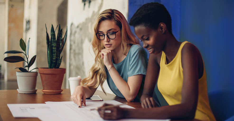 Two businesswomen working together in the office